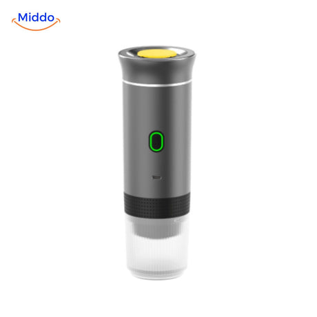 Portable espresso machine ready to brew with coffee capsule inserted.