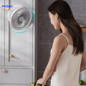 Portable cooling fan running in kitchen for effective air circulation.