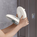 Portable fan mounted on wall for flexible cooling placement anywhere.