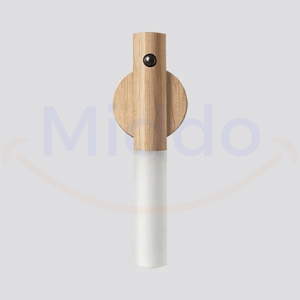 Professional product shot of white motion-activated portable LED lamp.
