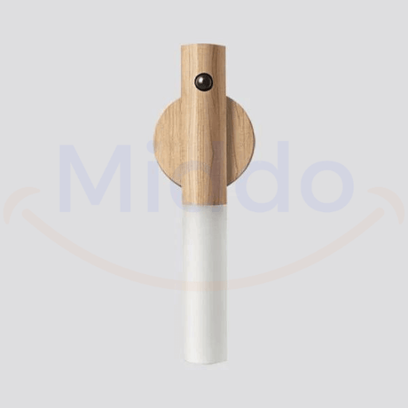 Professional product shot of white motion-activated portable LED lamp.