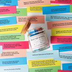 Prayer jar with colorful bible verses and wooden label on glass pot.