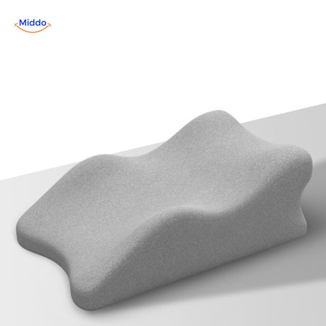 Grey leg elevation pillow designed for comfort and effective support positioning.