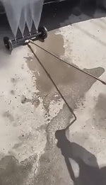 Intensive water jet spray removes dirt and grime from vehicle undercarriage.