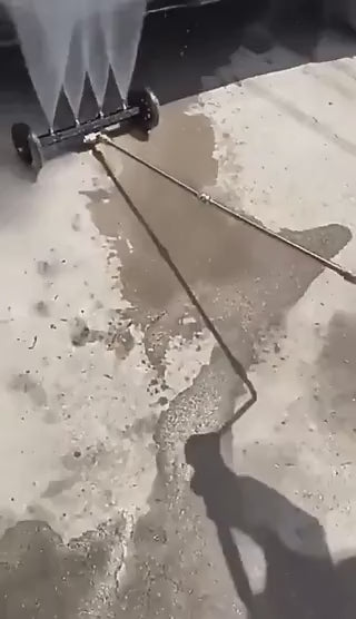 Intensive water jet spray removes dirt and grime from vehicle undercarriage.