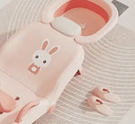 Baby shampoo chair with rabbit design pattern plus bonus slippers for comfortable bath play.