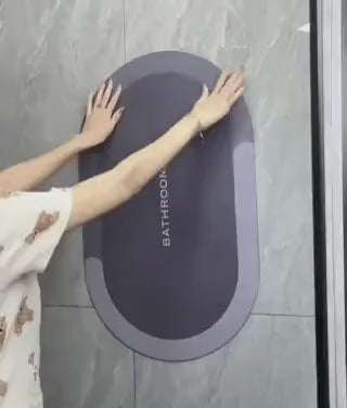 Quick-dry bath mat rolled up demonstrating flexible storage capability.