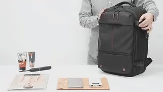 VacuPro compression backpack with multiple organizer pockets and accessories.