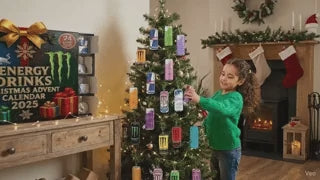 Child opening and discovering mini energy drink cans from the advent calendar.