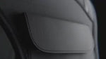 Close-up detail of waterproof premium fabric flap on reflective running vest for protection.