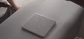 LED matrix game board with clean minimalist white design and interface.
