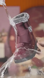 Red SnowLuxe winter boots designed for all-day comfort and reliable cold-weather warmth.