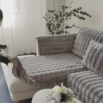 Gray luxury plush covers featuring non-slip backing for secure, wrinkle-free furniture fit.