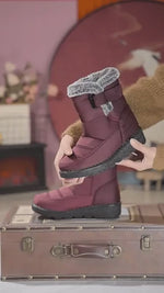 Red SnowLuxe waterproof snow boots with fur lining for reliable winter protection.