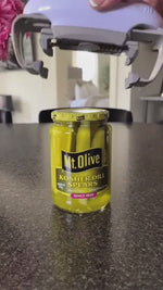 Automatic jar opener handles pickle jars and sealed containers easily.