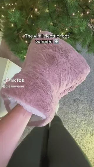 Person enjoying CozyPaws heated foot warmer during relaxation time.