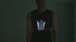 Reflective running vest phone holder designed for night visibility and safety during evening runs.