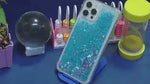 GlowSand phone case blue and pink glitter liquid sand arrangement display.