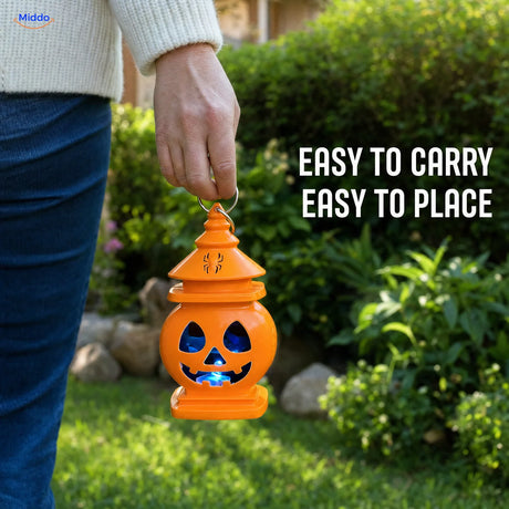 Adult carrying PumpkinGlow™ Halloween lantern by its metal ring