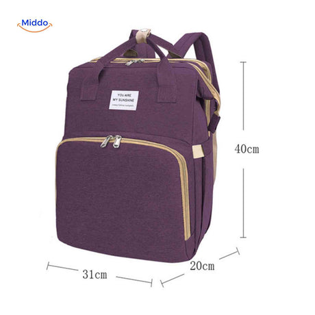 Purple compact diaper backpack with detailed dimensions and size specifications.