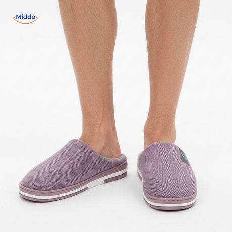 Man wearing purple non-slip cotton slippers, front view model.