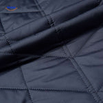 Quilted jacket showing quilted stitch pattern and texture detail.