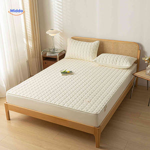 Quilted-top mattress protector delivering softness and waterproof defense.