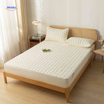 Quilted-top mattress protector delivering softness and waterproof defense.