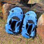 Blue racecar slippers styled for home wear with soft plush materials.