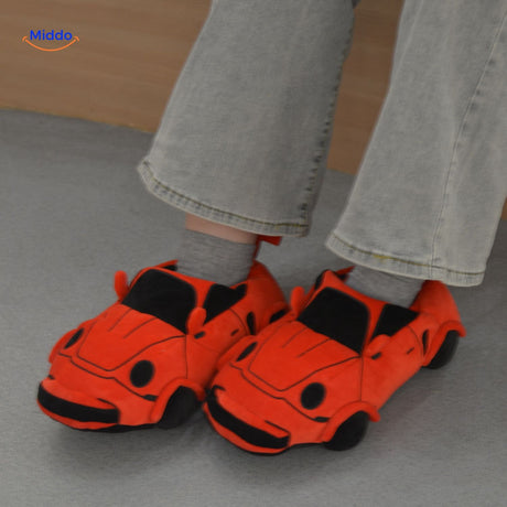 Orange racecar slippers featuring plush comfort for home relaxation.