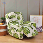 Reclinex recliner cover in white with large green monstera leaves.