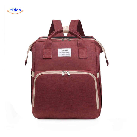 Red elegant diaper backpack with expansive storage capacity and organization.