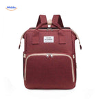 Red elegant diaper backpack with expansive storage capacity and organization.