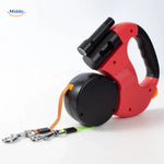 Red retractable leash showing dual attachment hook mechanism in detail.