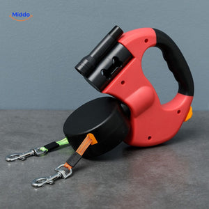 Red retractable dog leash with dual attachment clasp system.