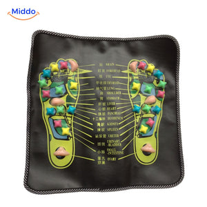 Feet on the ReflexoStep acupressure mat during health stimulation session.