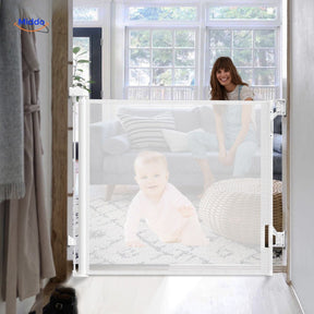 Retractable stair gate with protective mesh netting for baby and pet safety.