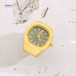 Gold ring watch with green square dial.