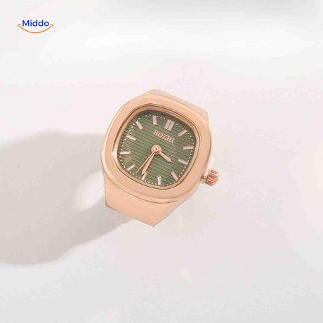 Rose gold ring watch with green square dial.