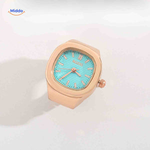 Rose gold ring watch with mint green square dial.
