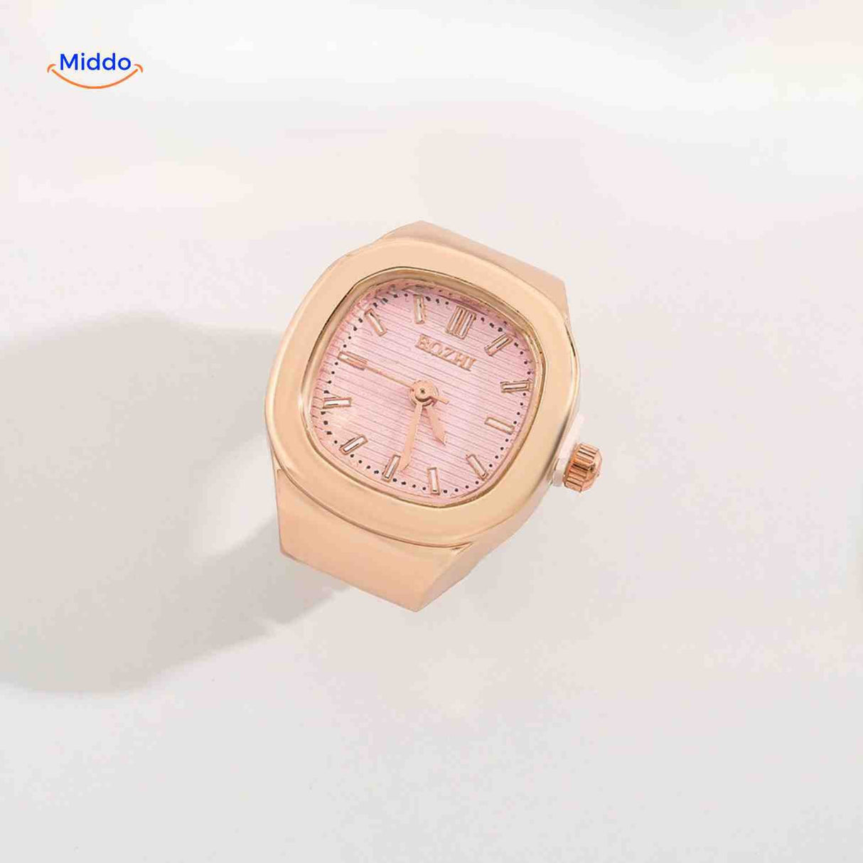 Rose gold ring watch with pink square dial.