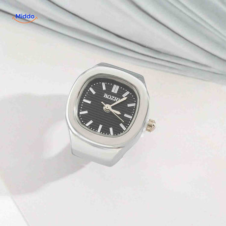 Silver ring watch with black dial, everyday style shot.
