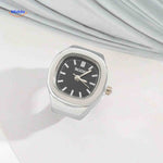 Silver ring watch with black dial, everyday style shot.