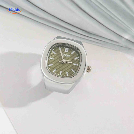 Silver ring watch with green square dial.