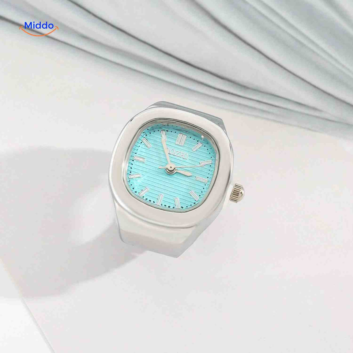 Silver ring watch with mint green square dial.