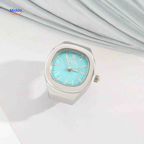 Silver ring watch with mint green square dial.