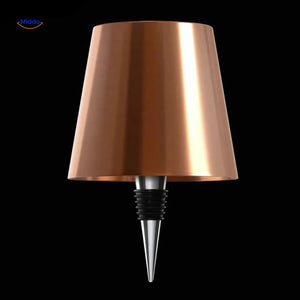 Rose gold rechargeable bottle lamp with warm elegant ambient lighting.