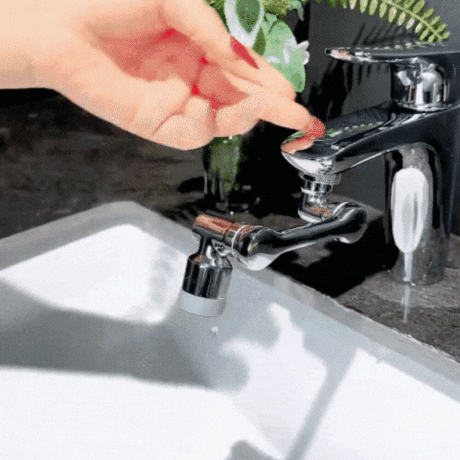 1080° rotating faucet attachment with two spray mode settings in action.