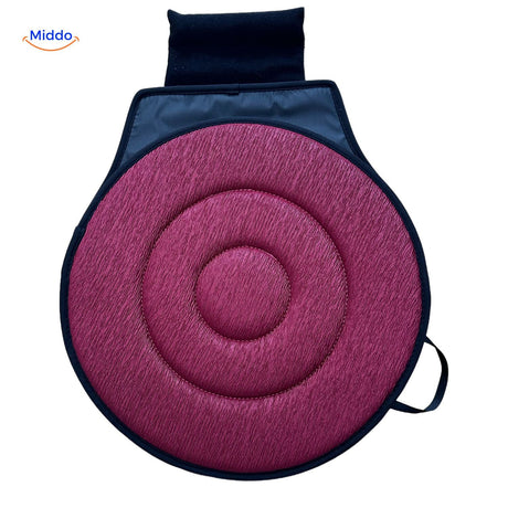 Red rotating seat cushion promoting spinal health benefits.