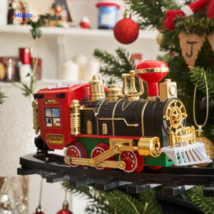ChristmasRail round train set surrounded by traditional holiday decoration pieces.